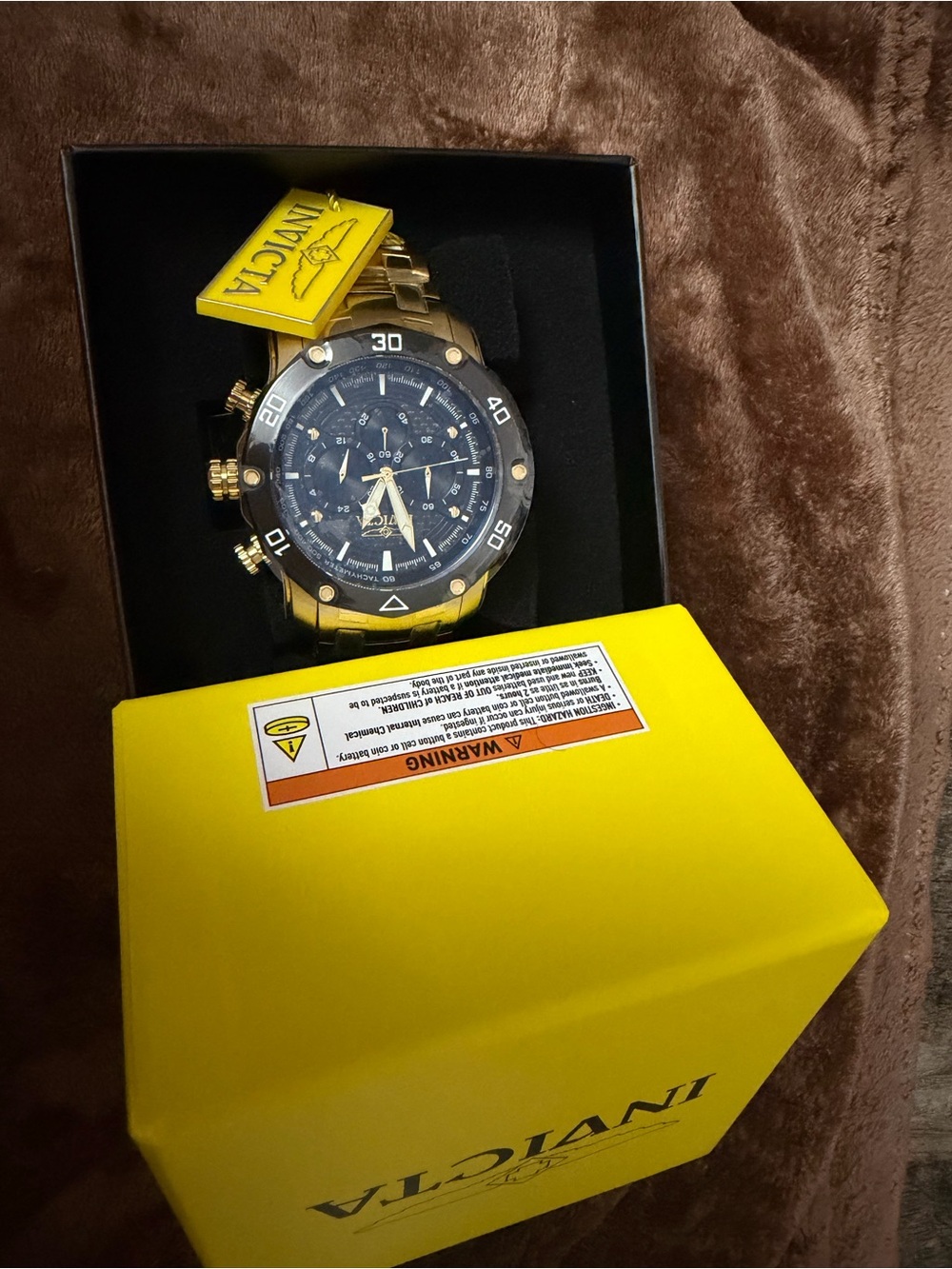 Invicta Gold Tone Watch with Black Dial and Bezel
